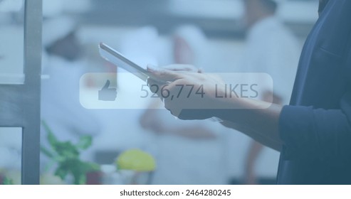 Image of social media text and icons over caucasian businessman using tablet. global social media, digital interface and business concept digitally generated image. - Powered by Shutterstock