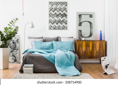 Image of spacious bedroom with modern stylish furniture