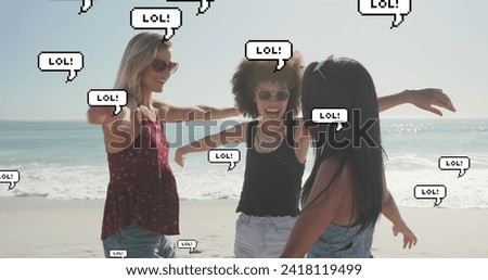 Image of speech bubbles with lol text over female friends on beach. digital interface, social media and global technology concept digitally generated image.