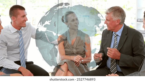 Image of spinning globe against diverse businesspeople discussing together at office. Global networking and business technology concept - Powered by Shutterstock