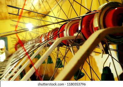 Image of spool of threads inside a silk weaving store in the silk weaving town of Sualkuchi, Guwahati in Assam, India