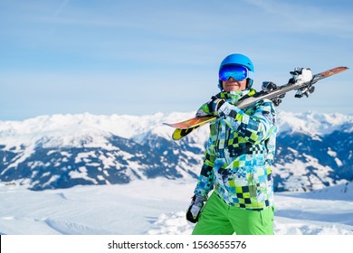 Image Of Sports Man In Helmet With Snowboard Standing On Snow Resort .