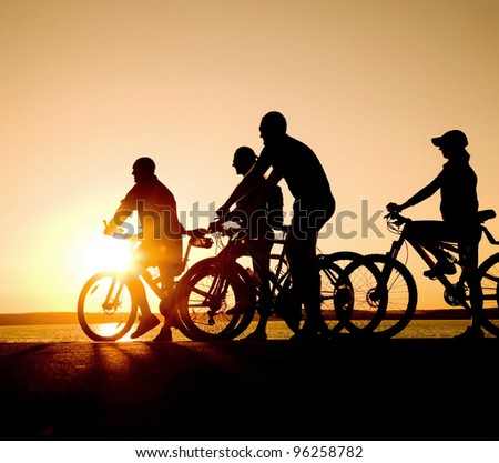 Similar – Image, Stock Photo 4 sporty cyclists on a bridge