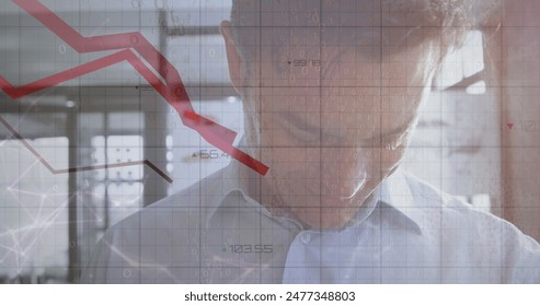 Image of statistical data processing against caucasian man using smartwatch at office. Computer interface and business data technology concept - Powered by Shutterstock