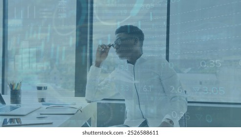 Image of statistical data processing over thoughtful african american man at office. Business data technology concept - Powered by Shutterstock