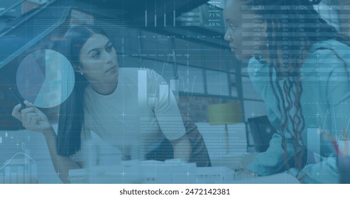 Image of statistical data processsing against two diverse women discussing over a plan at office. Computer interface and business data technology concept