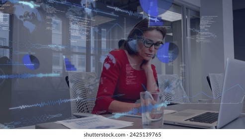 Image of statistics and data over caucasian businesswoman using laptop in office. Global business, communication, digital interface, finance and data processing concept digitally generated image. - Powered by Shutterstock - Get 15% off with code: PIKWIZARD15