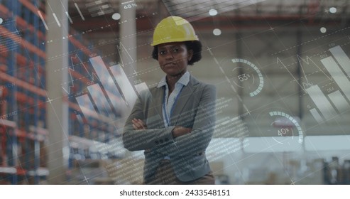 Image of statistics and data processing over african american woman working in warehouse. Global shipping, business, finance, computing and data processing concept digitally generated image.