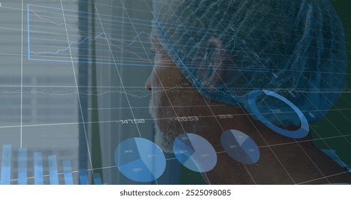 Image of statistics and data processing over caucasian male surgeon. Global medicine, connections, computing and data processing concept digitally generated image.