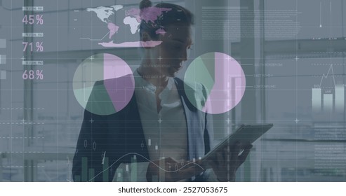 Image of statistics and data processing over busy city street. Global sports fitness data processing and digital interface concept digitally generated image.