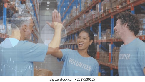 Image of statistics and data processing over diverse volunteers high fiving in warehouse. global shipping, business and data processing concept digitally generated image. - Powered by Shutterstock