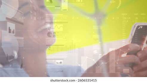 Image of statistics and data processing over businesswoman using smartphone. global business, data processing and technology concept digitally generated image.