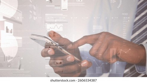 Image of statistics and data processing over businessman using smartphone. global business, data processing and technology concept digitally generated image.