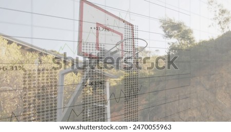 Image of statistics and data processing over basketball hoop. global sports and competition concept digitally generated image.
