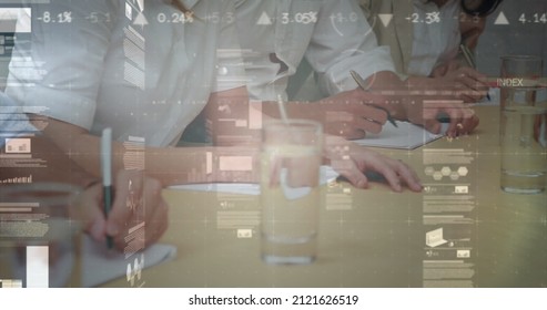 Image of statistics and financial data processing over business people in meeting. global business and data processing concept digitally generated image.