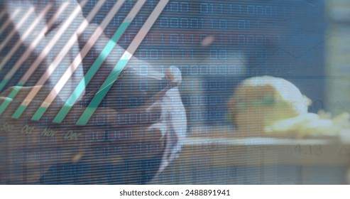 Image of statistics and financial data processing over caucasian man using smartphone. Global business, connections, networks and data processing concept digitally generated image.