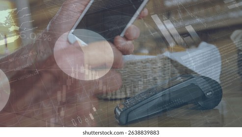 Image of statistics and financial data processing over caucasian man paying with smartphone. Global business, connections, networks and data processing concept digitally generated image.