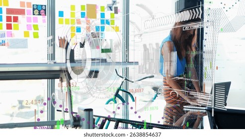 Image of statistics and financial data processing over caucasian businesswoman in office. Global business, data processing and digital interface concept digitally generated image.