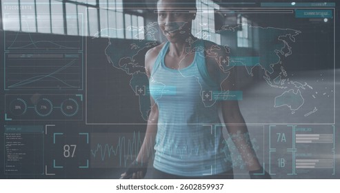 Image of statistics and graphs over woman jumping the rope in an abandoned building. Digital interface global sport and performance concept digitallygenerated image.