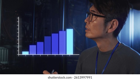 Image of statistics over asian male it engineer with clipboard by computer server. data processing, cloud computing concept and technology concept digitally generated image.