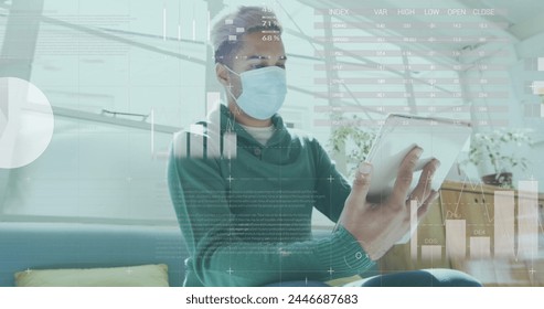 Image of statistics processing over businessman wearing face mask using tablet in office. global covid 19 pandemic and business workplace concept digitally generated image.