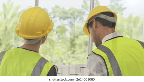 Image of statistics processing over male and female architects talking at construction site. business, development and productivity concept digitally generated image.