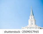 Image of the steeple and Angel Moroni on the top of the Huston, TX LDS Temple. This temple is a religious building owned by the Church of Jesus Christ of Latter Day Saints. 