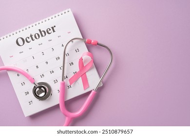 Image of a stethoscope and pink ribbon on a calendar showing October, symbolizing breast cancer awareness month and health care - Powered by Shutterstock