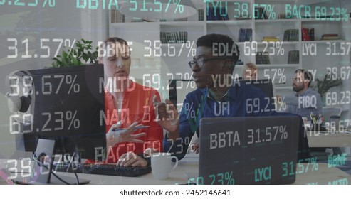 Image of stock market data processing over diverse man and woman discussing at office. Global economy and business technology concept