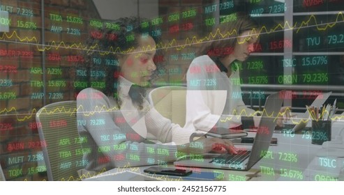 Image of stock market data processing over diverse female colleagues using laptop at office. Global economy and business technology concept