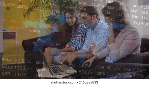 Image of stock market data processing over diverse colleagues discussing over laptop at office. Global economy and business technology concept