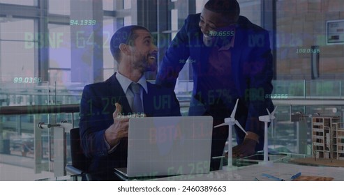 Image of stock market data processing over two diverse businessmen discussing at office. Global economy and business technology concept