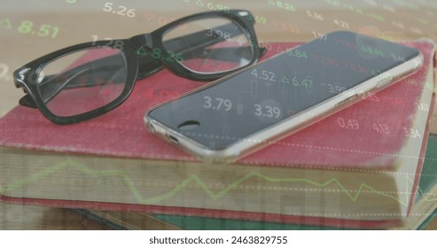 Image of stock market data processing over close up of books, smartphone and glasses. Global economy and business technology concept