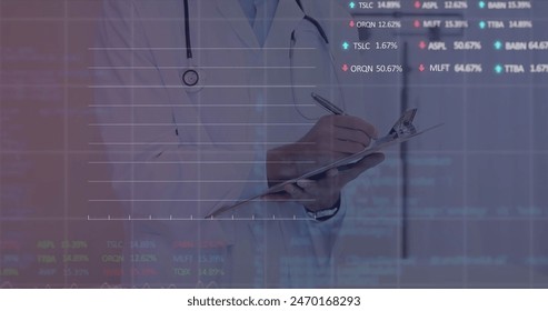 Image of stock market data processing over biracial male doctor writing on clipboard at hospital. Global economy and medical healthcare technology concept - Powered by Shutterstock