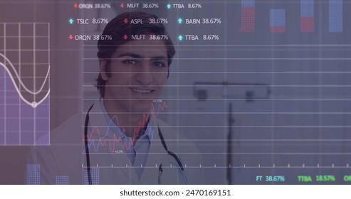 Image of stock market data processing over biracial male doctor writing on clipboard at hospital. Global economy and medical healthcare technology concept - Powered by Shutterstock