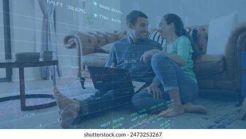 Image of stock market data processing over caucasian couple using laptop together at home. Global economy and business technology concept