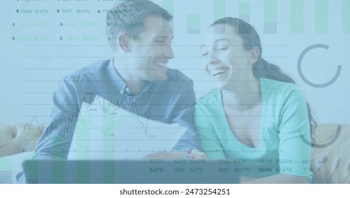 Image of stock market data processing over caucasian couple calculating finances at at home. Family budget and expenses concept - Powered by Shutterstock