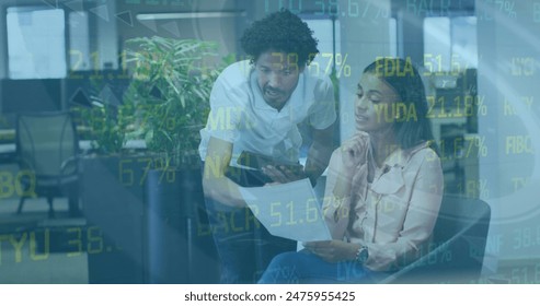 Image of stock market data processing over diverse male and female colleagues discussing. Global economy and business technology concept