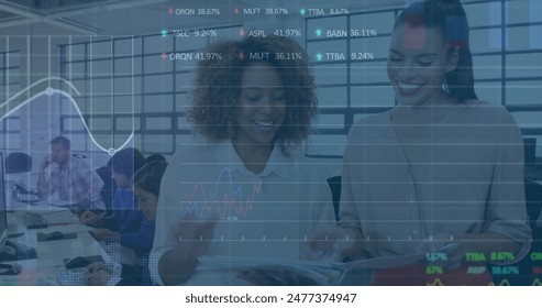 Image of stock market data processing over diverse man and woman discussing at office. Global economy and business data technology concept