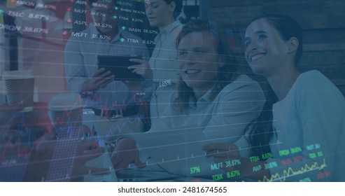 Image of stock market data processing over diverse man and woman discussing at office. Computer interface and business data technology concept