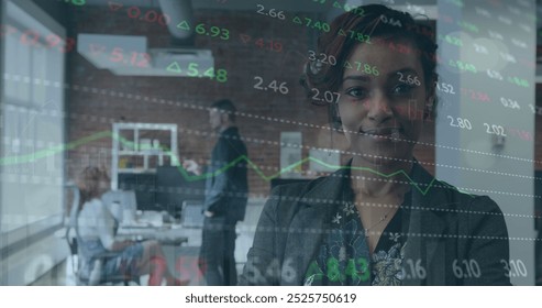 Image of stock market data processing against african american businesswoman smiling at office. Global economy and business technology concept