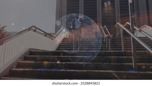 Image of stock market data processing over african american businessman walking down the stairs. Global economy and business networking technology concept - Powered by Shutterstock