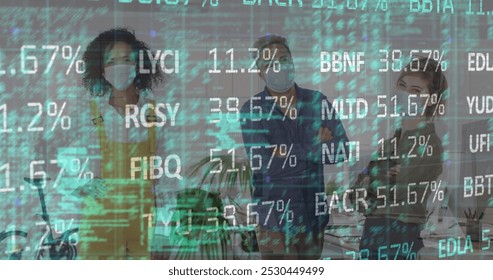 Image of stock market data processing over diverse colleagues wearing face masks at office. Global economy and business technology concept - Powered by Shutterstock