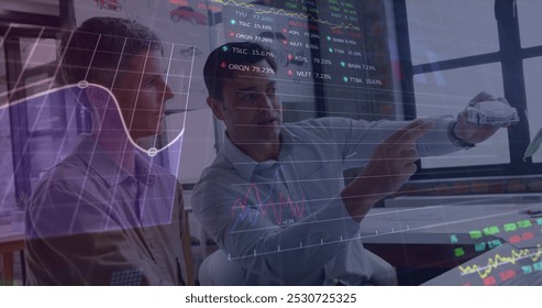 Image of stock market data processing over two diverse male engineers discussing over car model. Global business and architectural engineering technology concept - Powered by Shutterstock