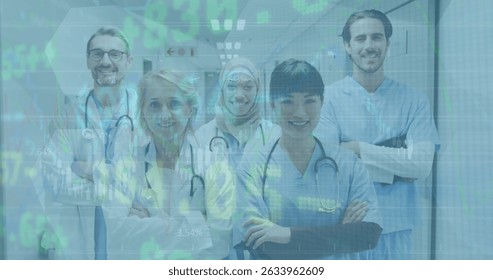 Image of stock market data processing over team of diverse medical health workers standing. Global economy and healthcare concept