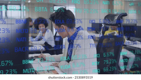 Image of stock market over diverse business people at office. Global business, computing and digital interface concept digitally generated image. - Powered by Shutterstock