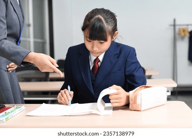 Image of students and teachers taking classes at a cram school
 - Shutterstock ID 2357138979