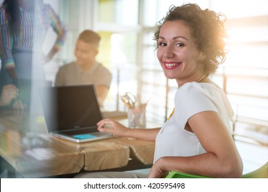 Image Of A Succesful Casual Business Woman Using Laptop During Meeting