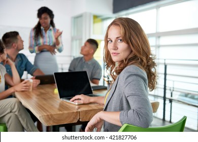 Image Of A Succesful Casual Business Woman Using Laptop During Meeting