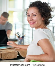 Image Of A Succesful Casual Business Woman Using Laptop During Meeting